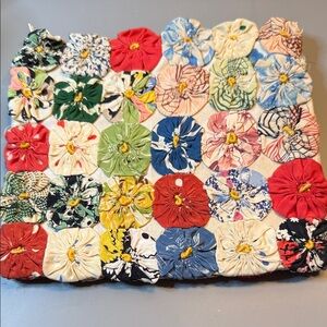 Adorable Handmade Clutch w/Vintage Yo-yo Quilt Pieces. Approximately 7”.5W x 7”H